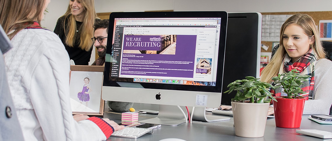 Whitespacepw Copywriter sitting at computer writing a blog post