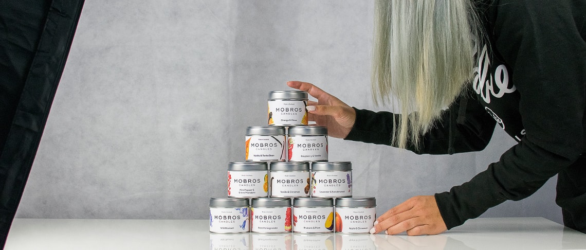 Whitespacepw product photographer setting up candles in a photography studio for the perfect photography composition