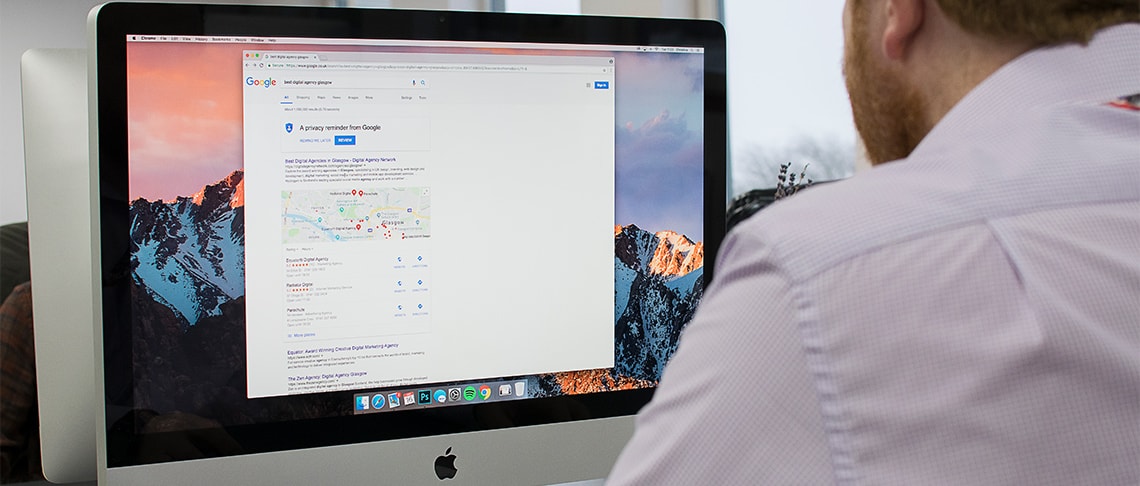 Whitespacepw PPC manager working at a computer and Google Search rankings