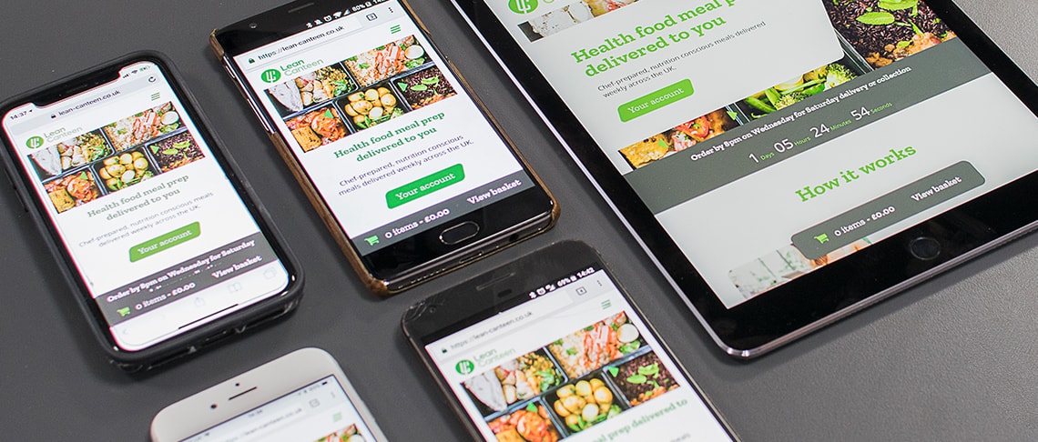 set of mobile devices and a tablet showing the responsive web design of an ecommerce website